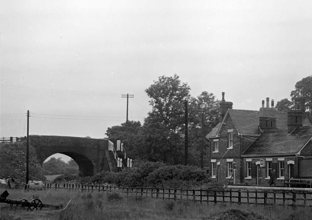 Close up showing the road over bridge on the left and Salford Priors station building on the right