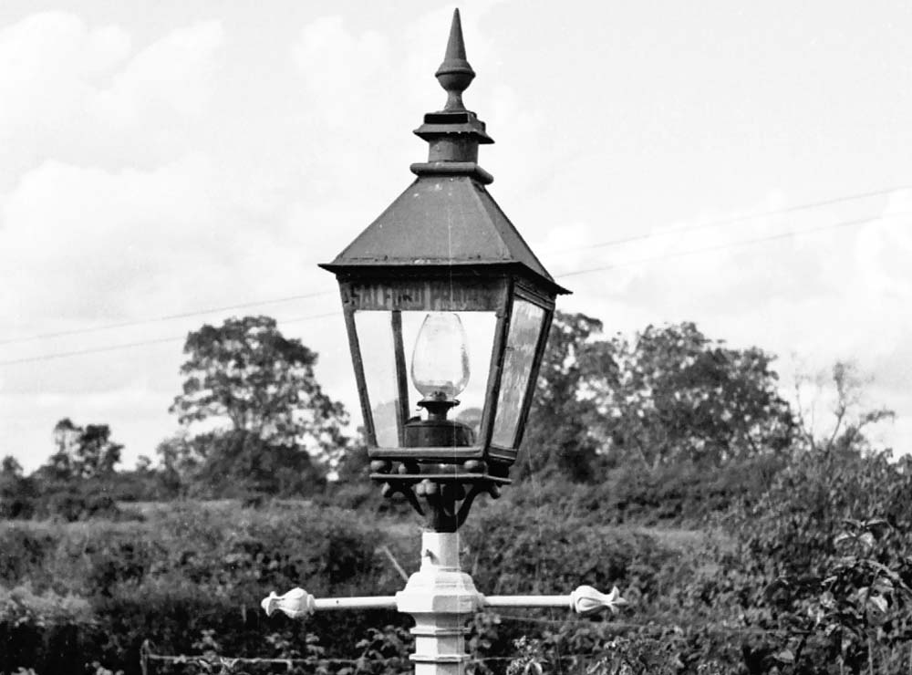 View of one of Salford Priors station's lampposts with the station name still visible on the outward face of the lantern