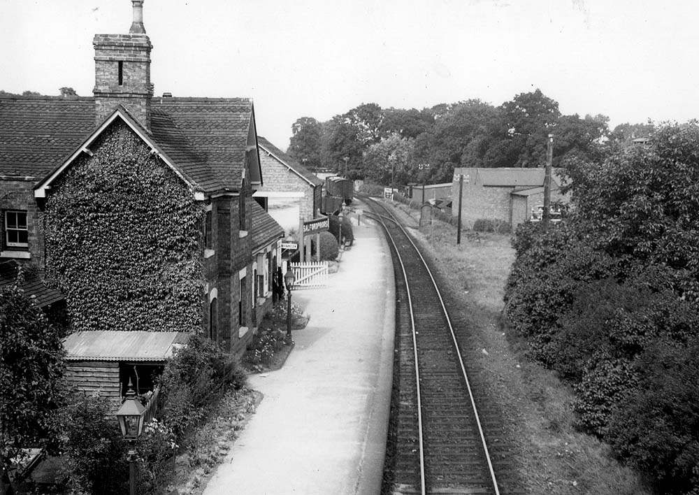 Looking towards Redditch with the single platform station  and the goods yard's facilities on the left