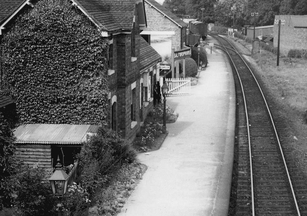 Close up showing the booking office and passenger facilities on the left in the single storey section of the station building