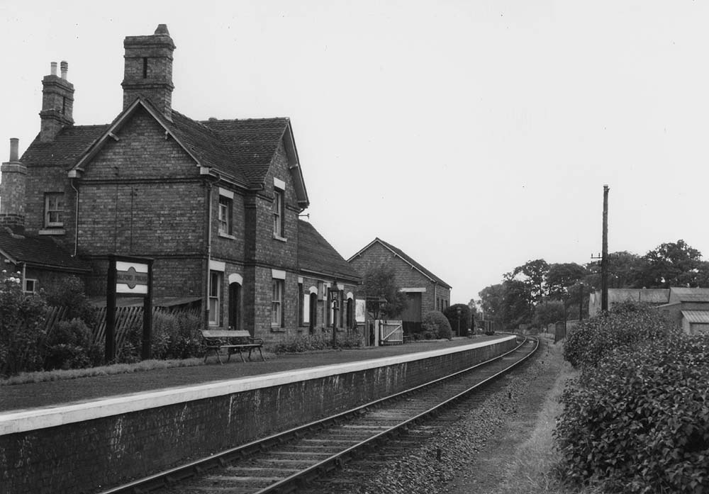 Looking towards Redditch along the single faced platform showing the LMS Hawkeye station nameboard