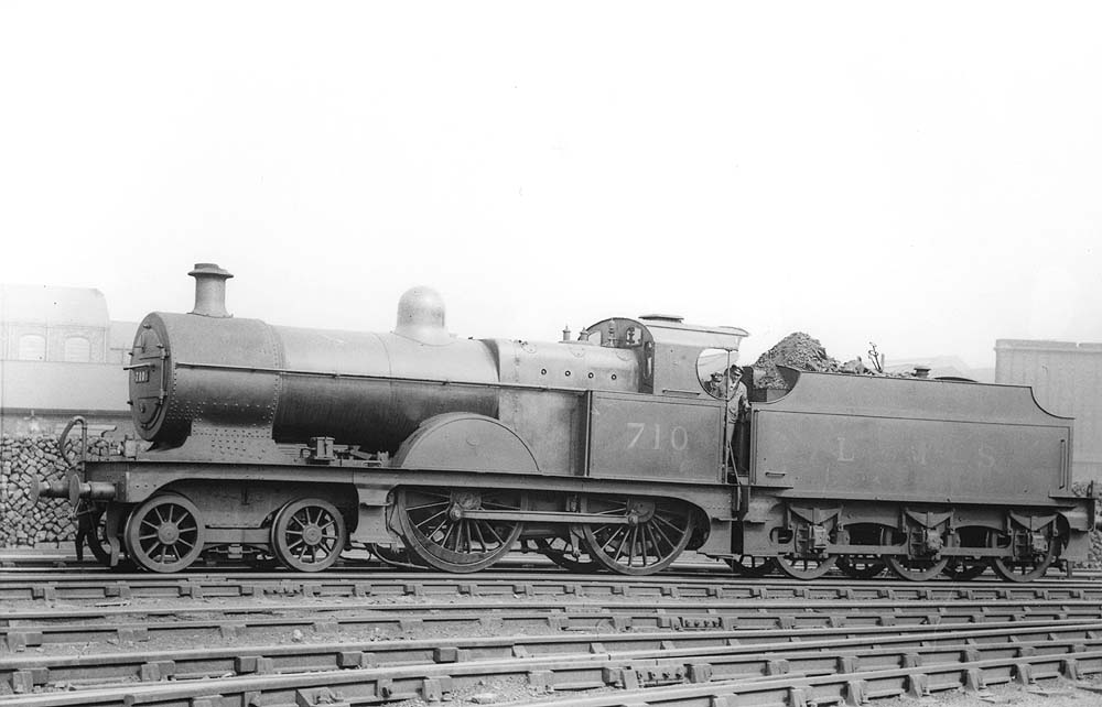 Ex-MR 3P 4-4-0 No 710, a member of the MR's 2606 class, stands alongside one of Saltley shed's many coal stacks as it prepares to leave the shed