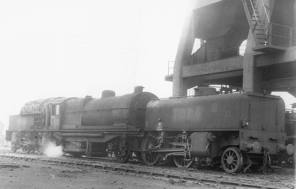 LMS 2-6-0+0-6-2 Garratt No 7994 stands alongside Saltley shed's coaling tower on its way to one of what were known as the 'back roads'