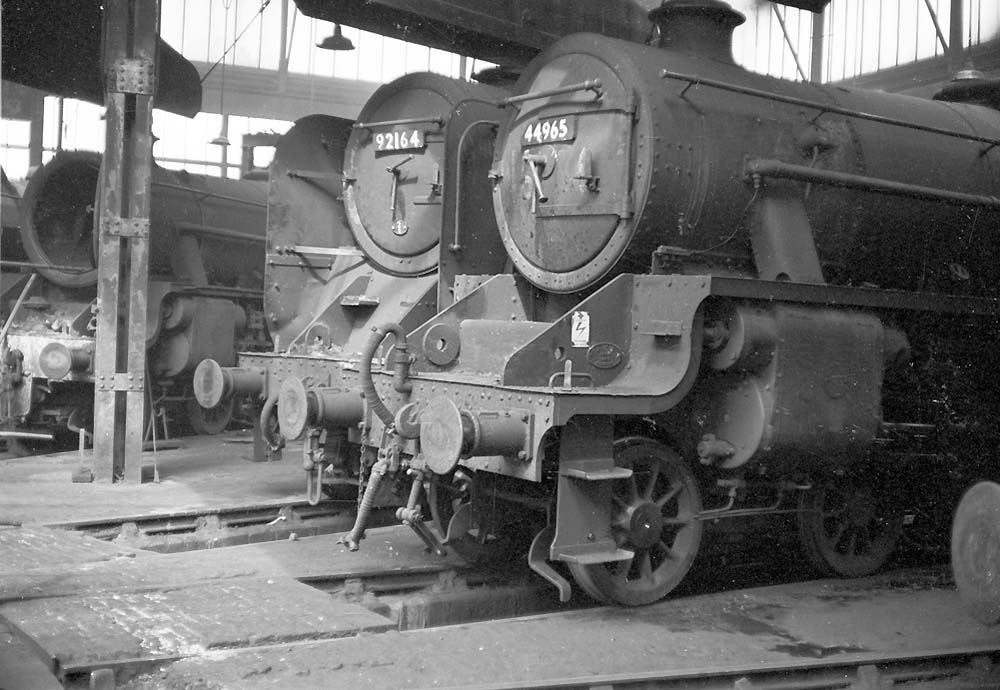 Ex-LMS 5MT 4-6-0 No 44965 and BR Standard Class 9F 2-10-0 No 92164 stand around Saltley shed's No 3 shed turntable