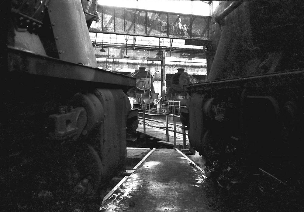 Ex-LMS 8F 2-8-0 No 48525 and class mate No 48538 stand opposite two other 8F locomotives inside No 3 roundhouse