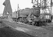 Ex-LMS 8F 2-8-0 No 48376 having been coaled stands over the ashpit having its firebox emptied of ash