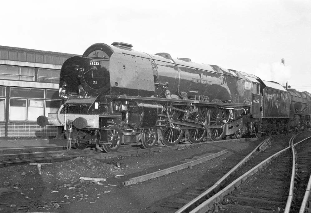 Ex-LMS 8P 4-6-0 No 46235 'City of Birmingham' stands outside Saltley shed's amenities block prior to being moved to Birmingham's Science Museum