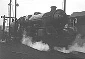 Ex-LMS 5XP 4-6-0 No 45697 'Achilles' is seen topping up her tender with water at Saltley shed