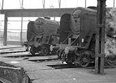 BR Standard Class 9F 2-10-0 No 92104 and No 92204 stand around the turntable of Saltley's No 3 roundhouse