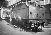 Ex-LMS 4F 0-6-0 No 44057 is seen with wisps of steam escaping inside Saltley shed's No 2 roundhouse