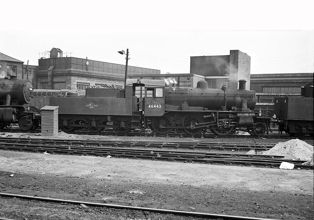 British Railways built 2MT 2-6-0 No 46443 stands in line on the disposal road at Saltley shed