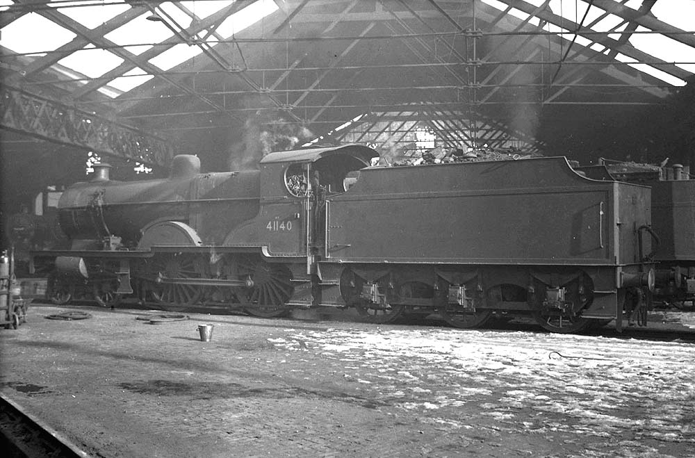 Ex-LMS 4P 4-4-0 No 41140 stands inside the roofless part of Saltley shed on 27th February 1955
