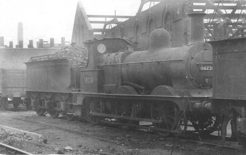 Ex-MR 2F 0-6-0 No 58230, fully coaled and watered, stands outside Saltley shed in June 1955