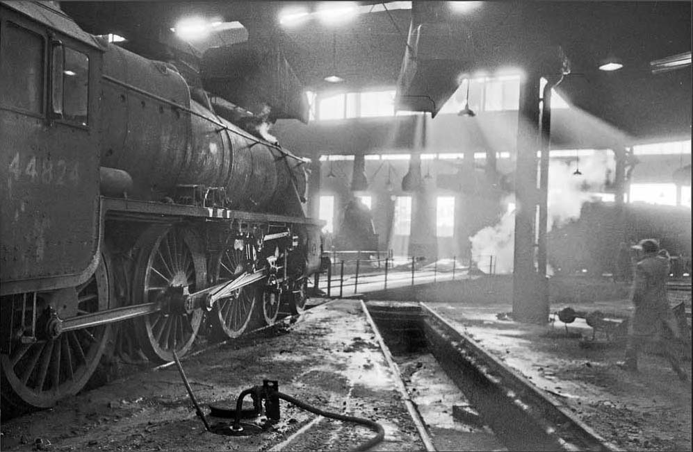 Ex-LMS 5MT 4-6-0 No 44825 stands inside a smokey Saltley roundhouse on 28th November 1965