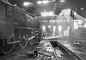 Ex-LMS 5MT 4-6-0 No 44825 stands inside a smokey Saltley roundhouse on 28th November 1965