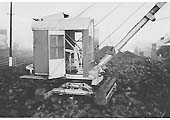 A crawler crane loads coal from Saltley shed's coal stack into 'Loco' wagons to be taken to the Coaling Tower