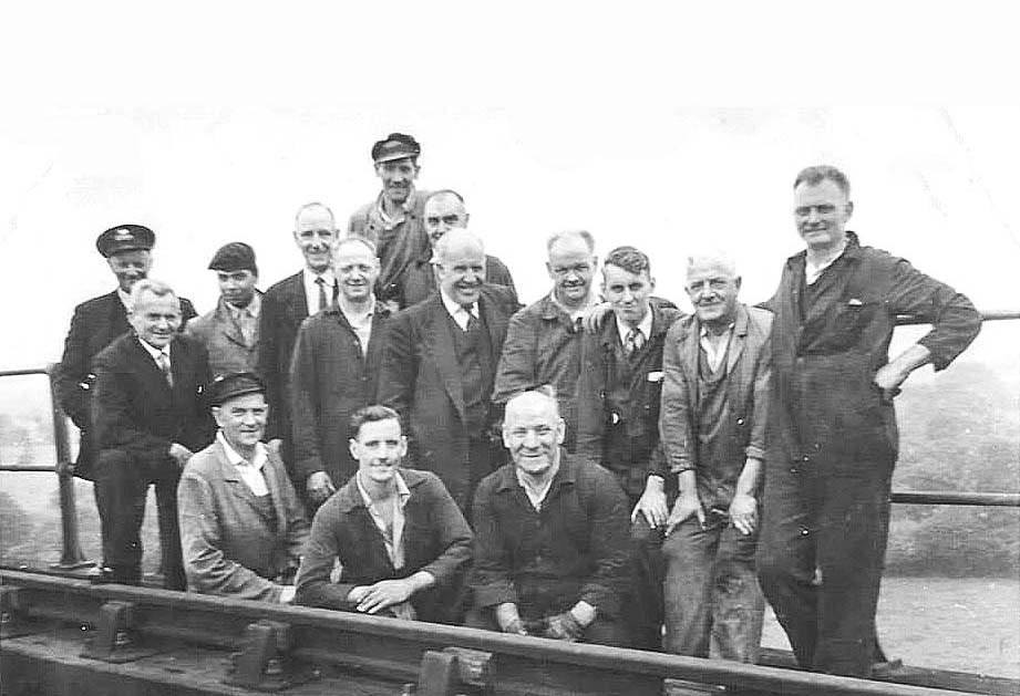 Saltley shed's breakdown crew pose for a photograph on a bridge somewhere in the adjacent countryside