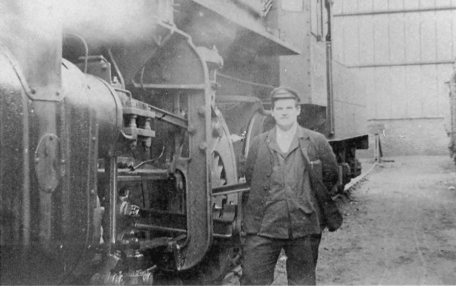 John Griffiths stands besides British Railways built 2-6-0 4MT No 43049's valve gear and guide bar support in 1961