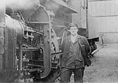John Griffiths stands besides British Railways built 2-6-0 4MT No 43049's valve gear and guide bar support in 1961