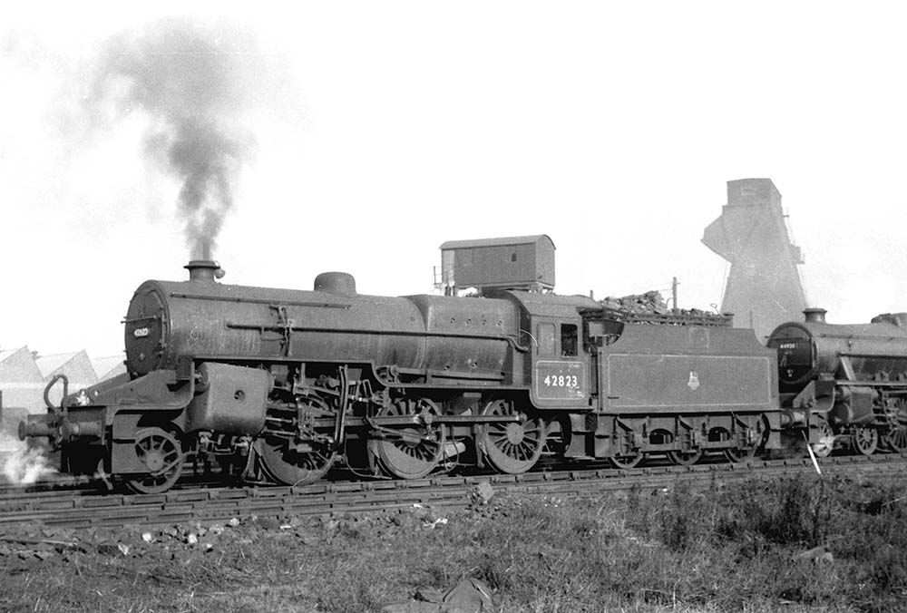 Ex-LMS 5F6P 'Crab' 2-6-0 No 42823 raises steam as it stands ready to leave Saltley shed on 26th March 1956