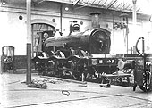 Midland Railway 2F 0-6-0 No 697, a member of Kirtley's 700 class, is seen inside Saltley shed under repair with buffers removed