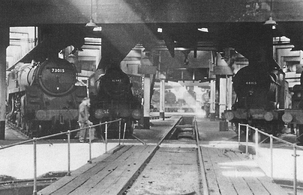 View from the turntable of one of Saltley's two roundhouses towards the other with a BR Standard locomotive in company with two ex-LMS engines