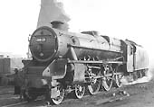 Ex-LMS 5MT 4-6-0 No 4813 is seen passing Saltley shed's coaling tower on its way to its next trip whilst still wearing its full LMS livery