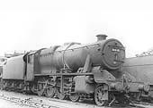 LMS 8F 2-8-0 No 8402 is seen standing 'cold' in line with other engines on the stabling roads outside Saltley shed's No 3 roundhouse