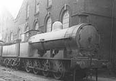 Ex-LNWR 7F No 8895, a Bowen-Cooke class G2a locomotive, is seen stabled with other engines alongside Saltley shed's No 3 roundhouse