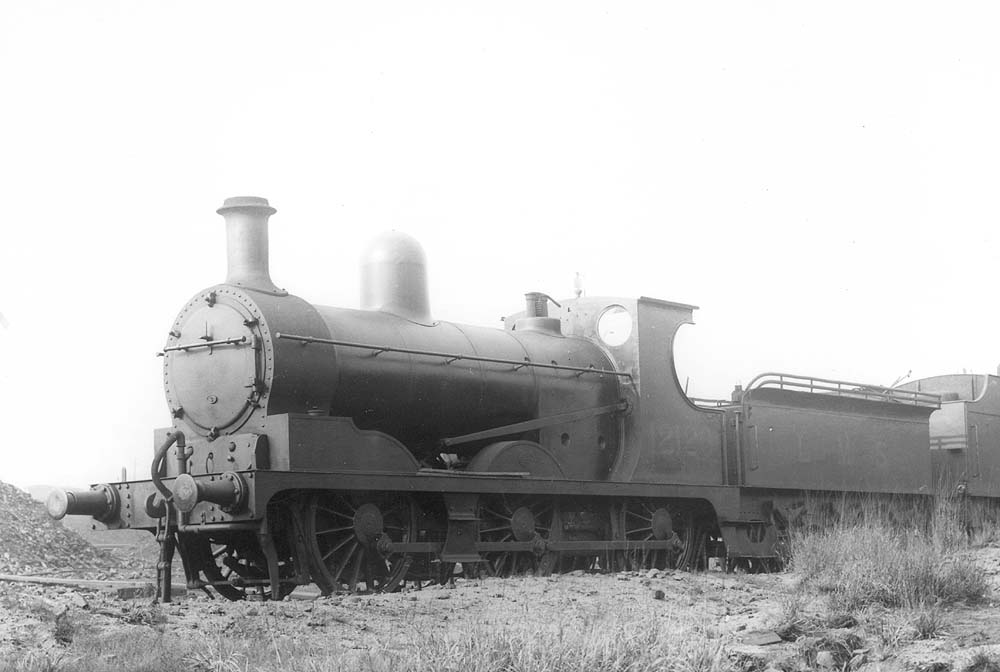 Ex-Lancashire & Yorkshire Railway 3F 0-6-0 No 12126 is seen on one of Saltley shed's disposal roads outside No 3 roundhouse