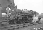 BR Standard class 4MT 4-6-0 No 75023 stands alongside the coaling plant being prepared for the semi-fast Birmingham to Bristol Temple Meads service