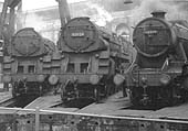 An unidentified BR 'Crosti' 2-10-0 and classmate No 92024 are seen in company with ex-LMS 8F 2-8-0 No 48339 stabled in one of Saltley's roundhouses