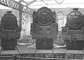 BR 9F 2-10-0 No 92066 in company with ex-LMS 5MT 4-6-0s No 44775 and No 45440 on the stabling roads inside Saltley shed's No 3 roundhouse