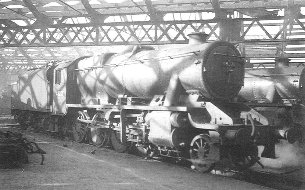 Ex-LMS 8F 2-8-0 No 48271 is seen standing inside one of Saltley Shed's roundhouses with steam escaping from its cylinder cocks on 2nd April 1950