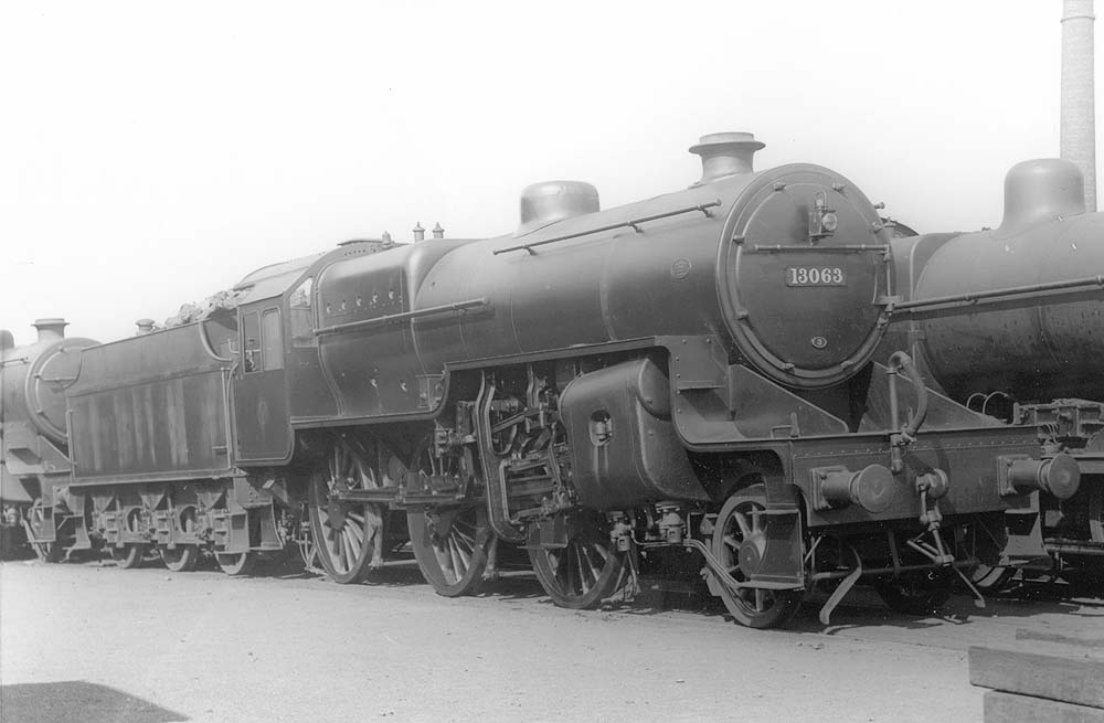 LMS 6P5F 2-6-0 'Crab' No 13063 is seen standing in line with an unidentified class mate in front of Saltley No 3 roundhouse and alongside an unidentified LMS 4F