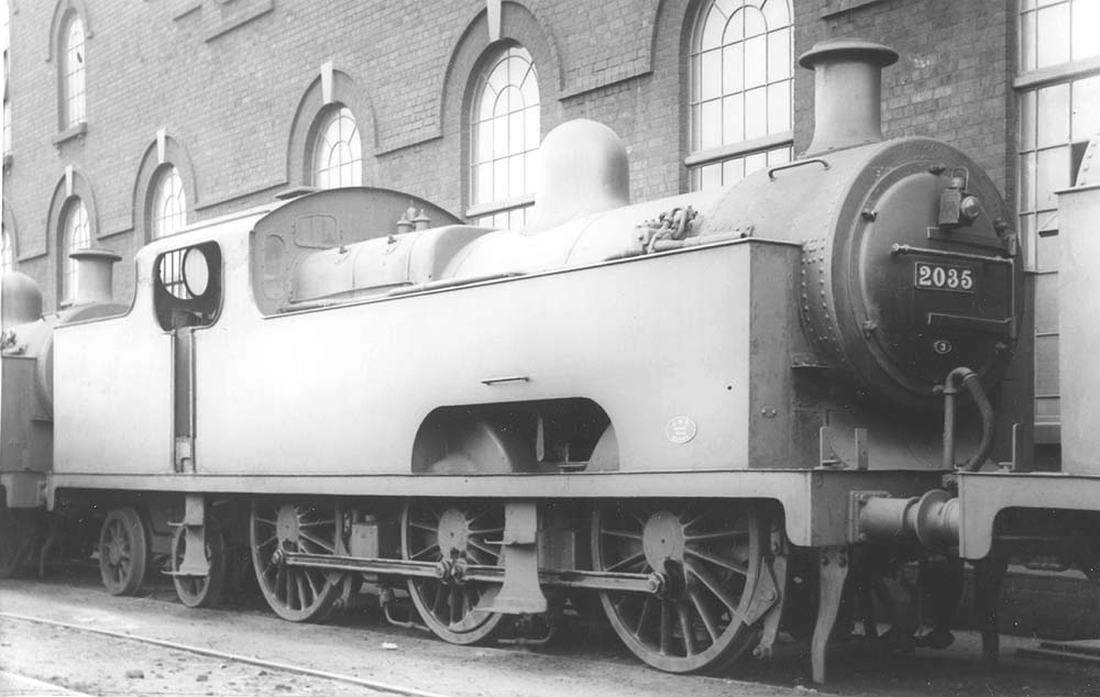 Ex-MR 0-6-4T 'Flatiron' No 2035 is seen stabled on the road alongside Saltley sheds No 1 and No 3 roundhouses still wearing Saltley's No 3 MR shed plate