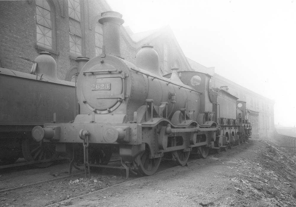 Ex-MR 1F 0-6-0 No 2623, an early design by Kirtley with outside curved frames, stands at the front of other class members alongside Saltley No 3 roundhouse