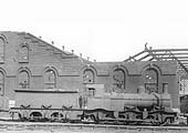 Ex-MR Kirtley 2F 0-6-0 No 22853, complete with outside curved frames, is seen standing alongside the war-damaged corner of No 3 roundhouse