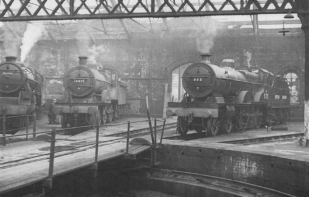 Ex-LMS 4P 4-4-0 Compound No M935 and ex-LMS 5MT 4-6-0 No 5274 are stabled inside the shed