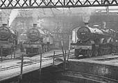 Ex-LMS 4P 4-4-0 Compound No M935 and ex-LMS 5MT 4-6-0 No 5274 are stabled inside the shed