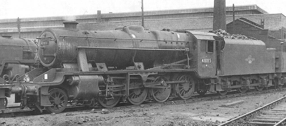 Ex-LMS 8F 2-8-0 No 48185 is being prepared to return to its home shed of Toton during the 1960s