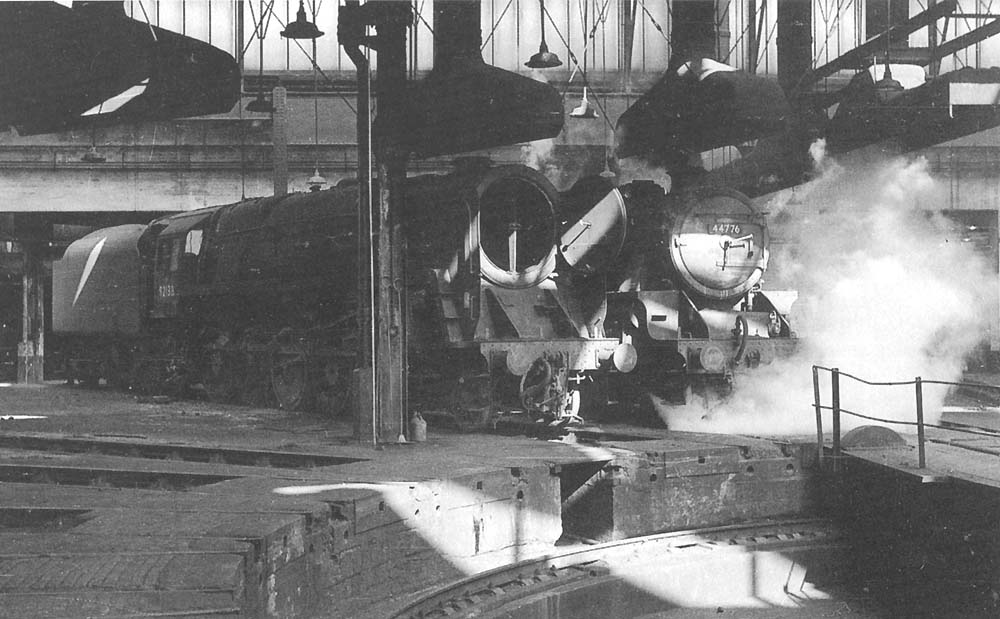 Ex-LMS 5MT 4-6-0 No 44776 fills the shed with steam as BR Standard 9F 2-10-0 No 92138 is being prepared for another day's work