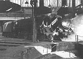 Ex-LMS 5MT 4-6-0 No 44776 fills the shed with steam as BR Standard 9F 2-10-0 No 92138 is being prepared for another day's work