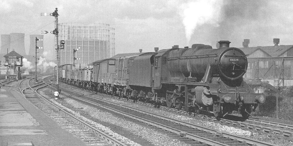 Ex-LMS 8F 2-8-0 No 48339 is seen working hard climbing towards Camp Hill on 26th April 1958