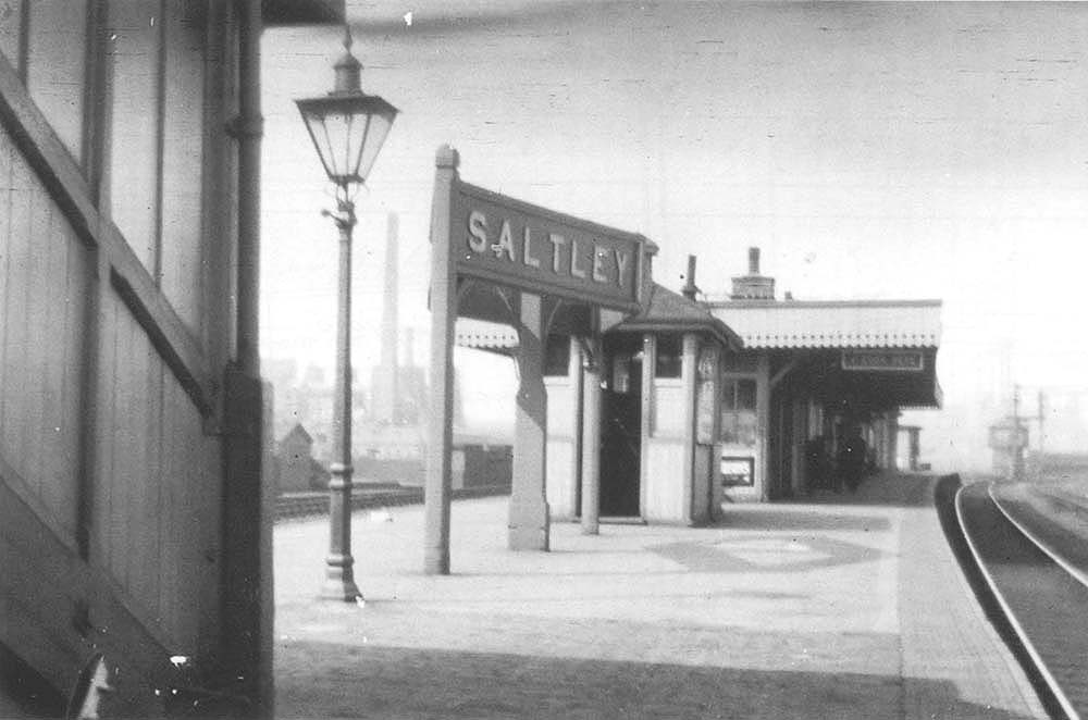 A view looking towards Washwood Heath showing the station's double sided angled station nameboard