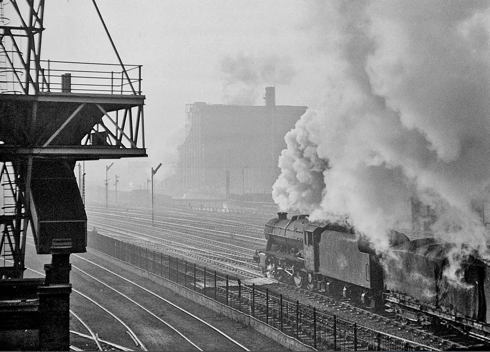 Ex-LMS 2-8-0 8F No 48273 is working hard as it passes through Saltley on a cold 7th December 1962