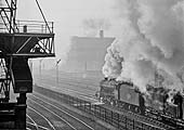 Ex-LMS 2-8-0 8F No 48273 is working hard as it passes through Saltley on a cold 7th December 1962