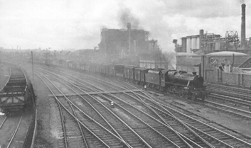 Ex-LMS 4-6-0 'Black Five' No 44814 is seen on a class 'D' part-fitted fast freight approaching Saltley station on the up goods line 