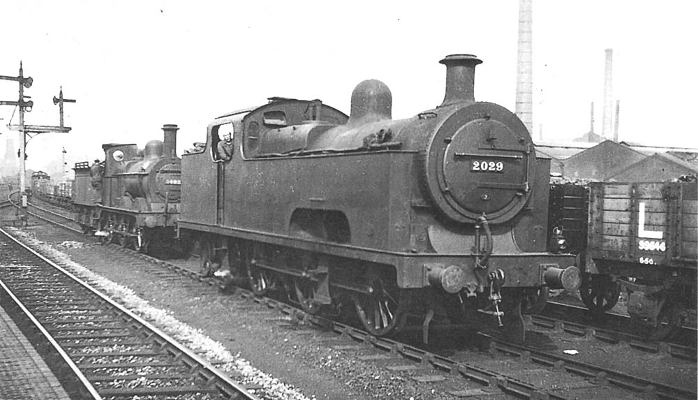 Ex-Midland Railway 0-6-4T 'Flatiron' No 2029 and ex-MR 2F 0-6-0 No 3492 are seen standing on the down goods line alongside Saltley station