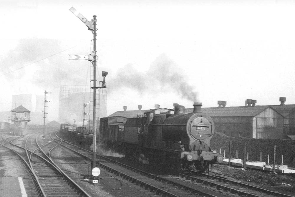 Ex-LMS 0-6-0 4F No 44272 is seen working hard on a down freight service on 28th October 1951